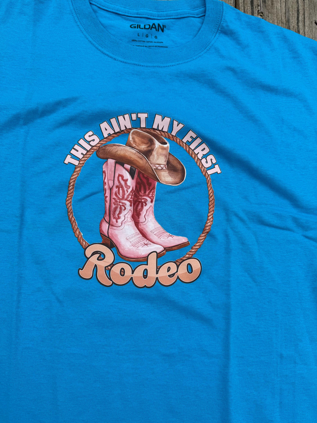 Blue Western Graphic Tee – "This Ain't My First Rodeo" Cowboy Boots & Cow Skull (Size Large)