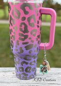 Green Heart Truck country music tumbler cup handle charm clipped to a pink and purple leopard print insulated tumbler — 