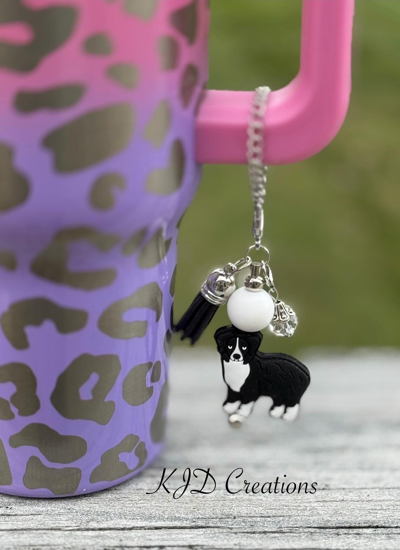Aussie - Australian Shepherd Dog tumbler cup handle charm clipped to a pink and purple leopard print ombre insulated tumbler — silver chain with white bead, black tassel, and Aussie - Australian Shepherd Dog charm by KJD Creations