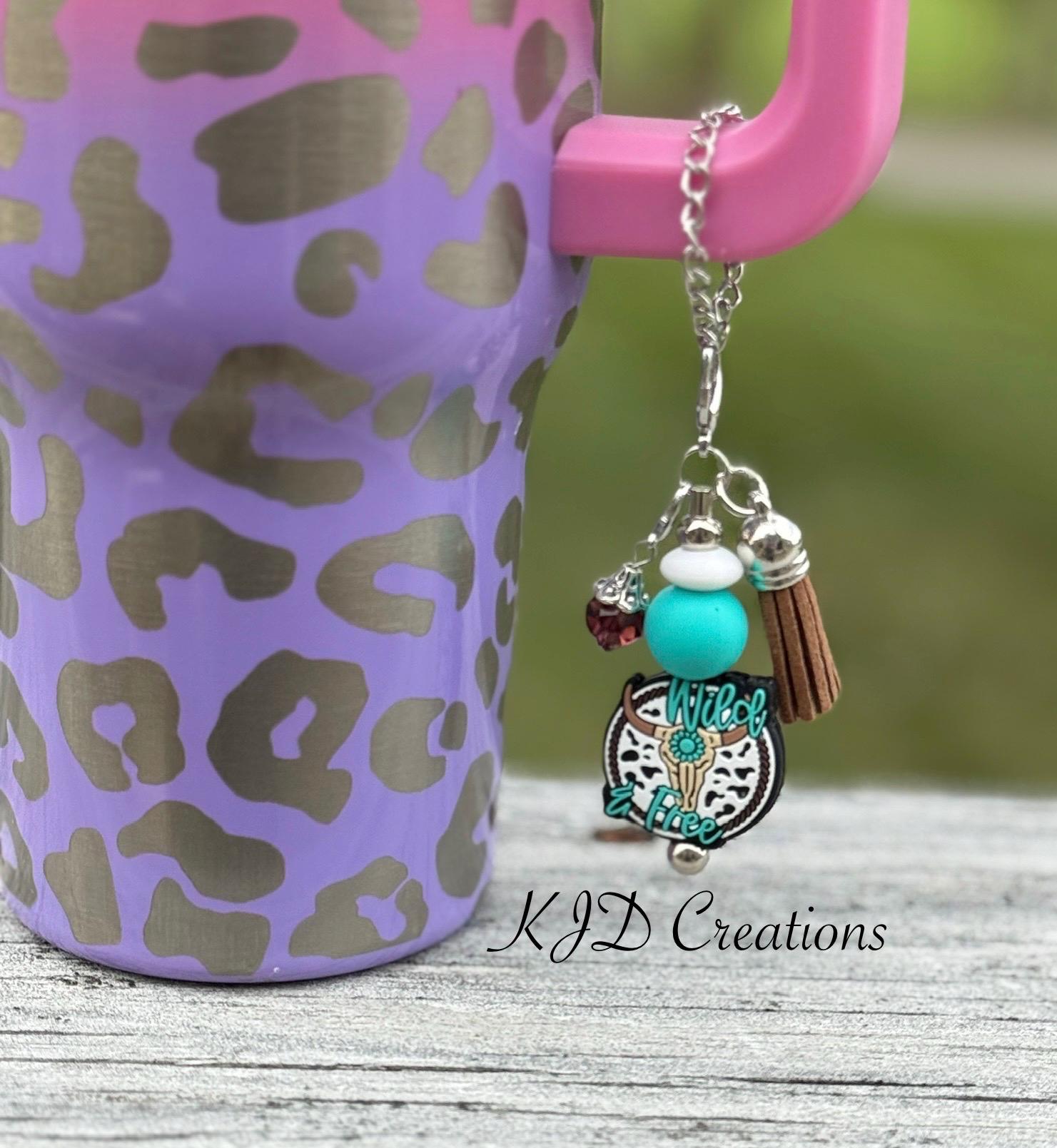 Longhorn Wild & Free Western tumbler dangle charm on display rack — teal longhorn charm with turquoise bead and brown leather tassel by KJD Creations