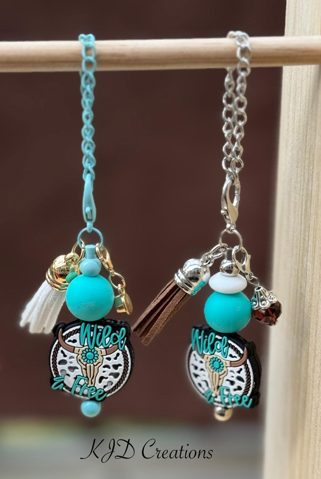 Longhorn Wild & Free Western tumbler dangle charm on display rack 