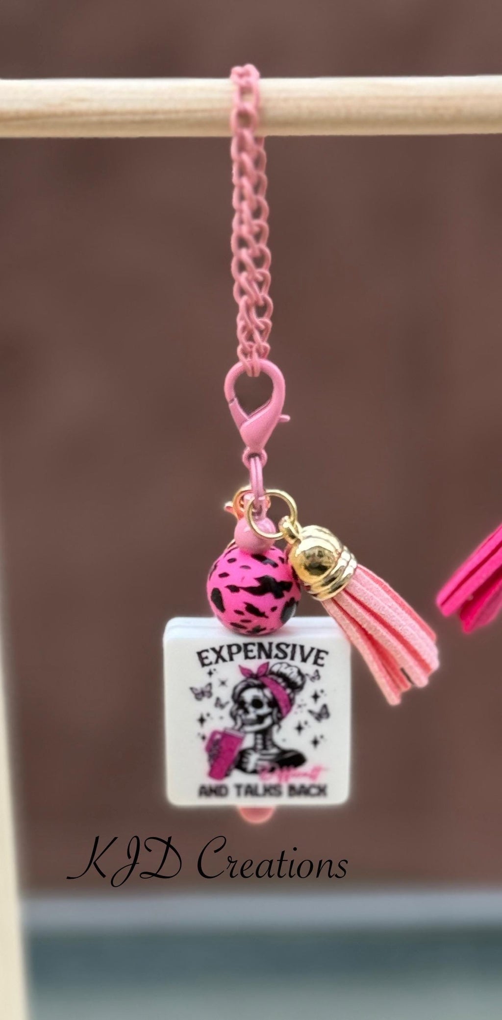 Funny silicone beaded tumbler cup charm with "Expensive and Talks Back" pendant, pink leopard bead, and pink leather tassel on pink chain