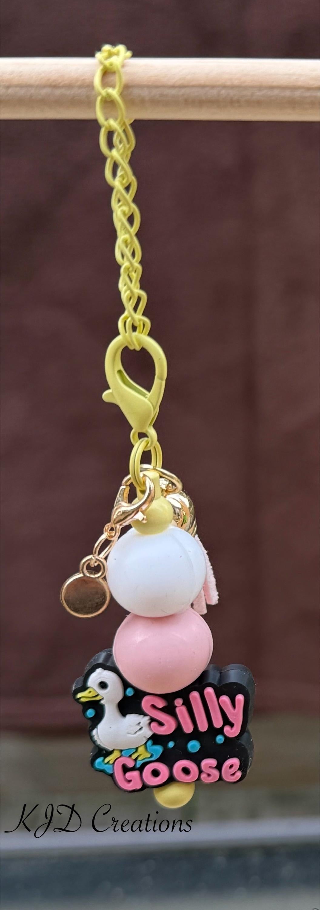 Silly Goose tumbler charm close-up on display rack — gold chain with white and pink silicone beads and Silly Goose charm by KJD Creations