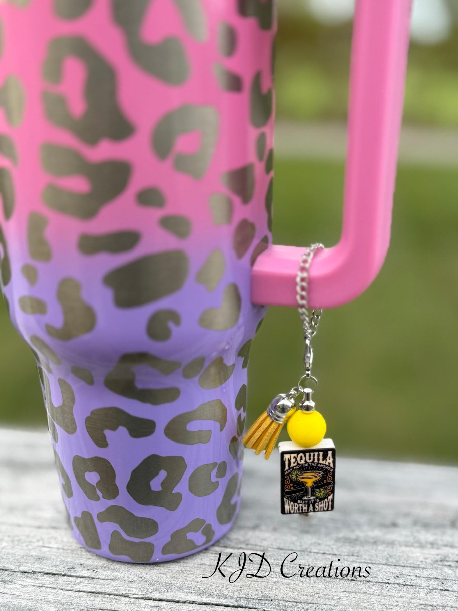 Tequila Worth a Shot tumbler cup handle charm clipped to a pink and purple leopard print ombre insulated tumbler — silver chain with yellow bead, gold tassel, and tequila novelty charm by KJD Creations