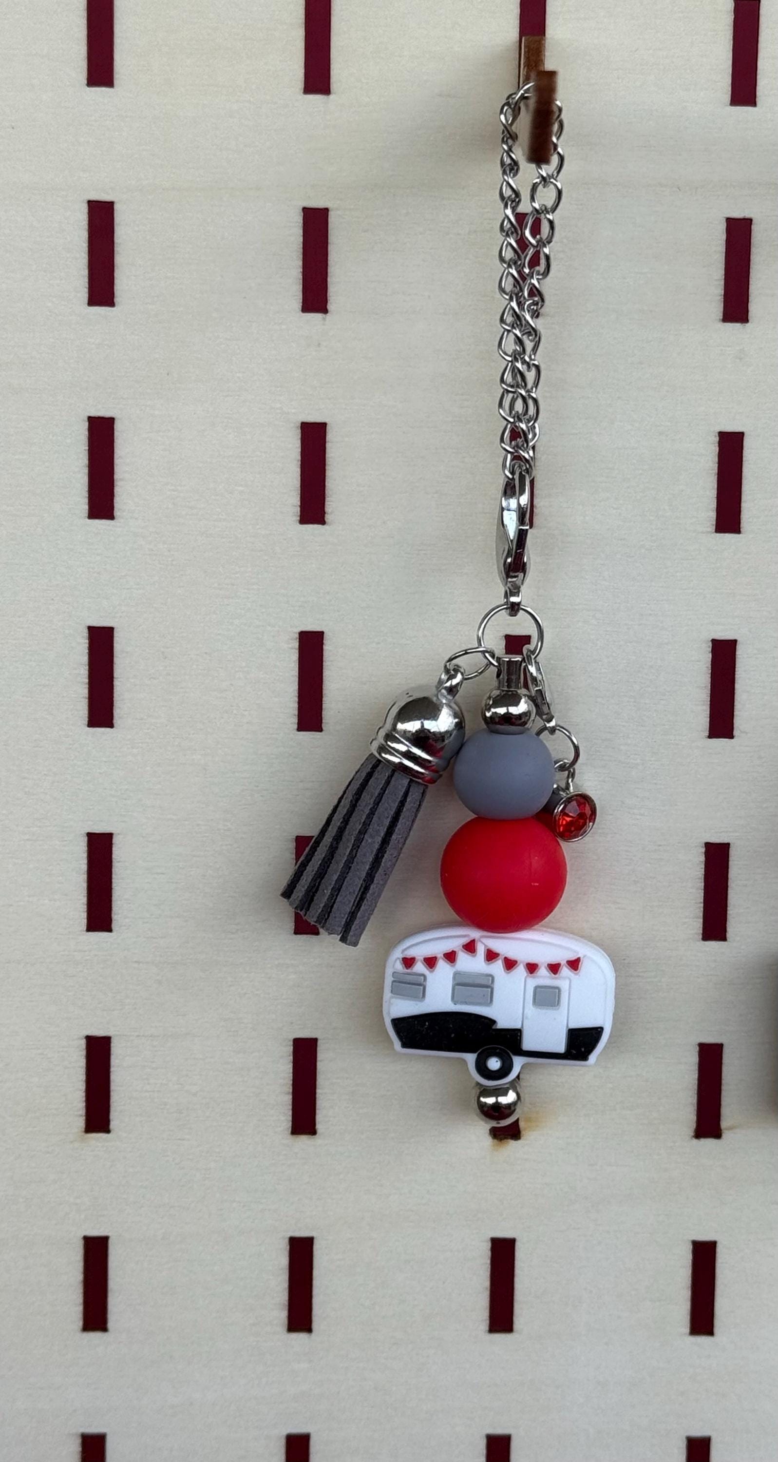 RV Happy Camper silicone beaded tumbler cup charm in white with colorful beads, miniature red and white retro camper charm, and tassel on silver chain