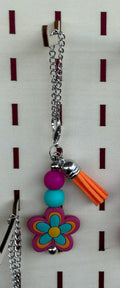 Western boho silicone beaded tumbler charm with purple flower bead, teal round bead, and orange tassel on silver chain