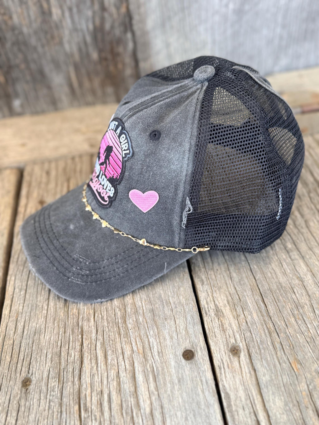 "Just A Girl Who Loves Bigfoot" Black Distressed Ponytail Trucker Hat | Bigfoot Patch & Gold Heart Hat Chain