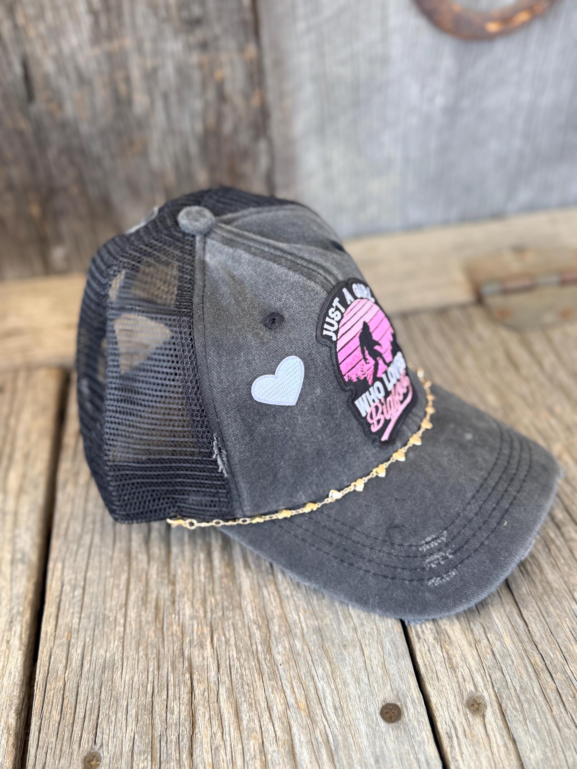 "Just A Girl Who Loves Bigfoot" Black Distressed Ponytail Trucker Hat | Bigfoot Patch & Gold Heart Hat Chain