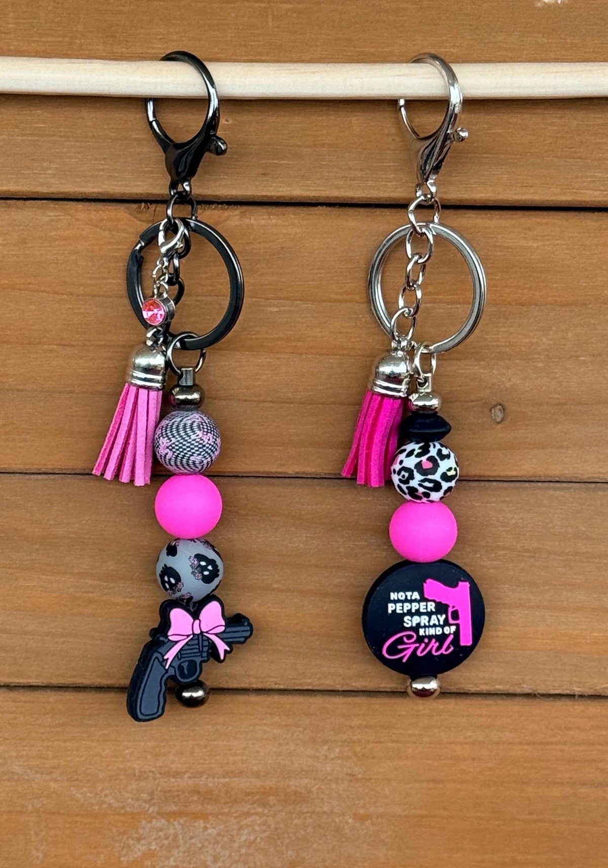Pew Pew Pistol & Bow Silicone Beaded Keychain with Leather Tassel