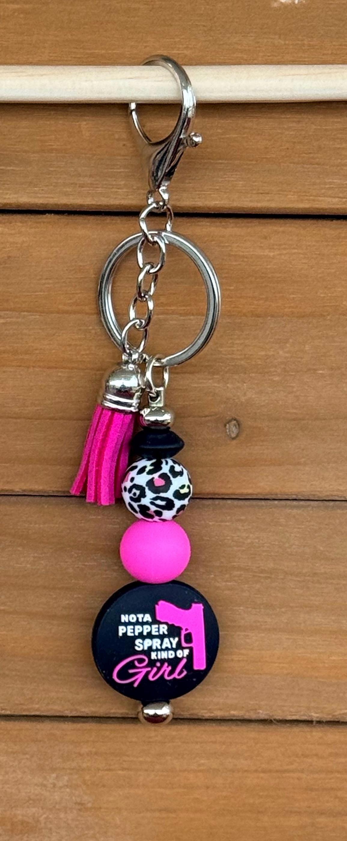 Pew Pew Pistol & Bow Silicone Beaded Keychain with Leather Tassel