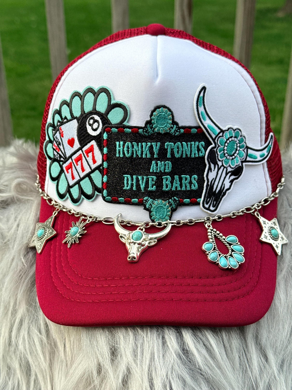 A red and white trucker hat with a custom embroidered patch reading 'HONKY TONKS ' and turquoise accents, 